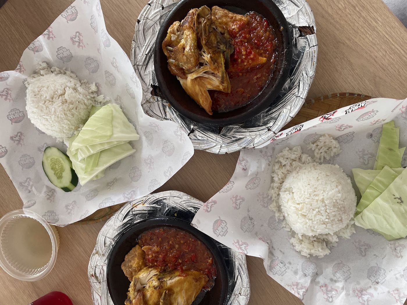 Three nasi sets on Sambal Bakar Malaya wrapping paper
