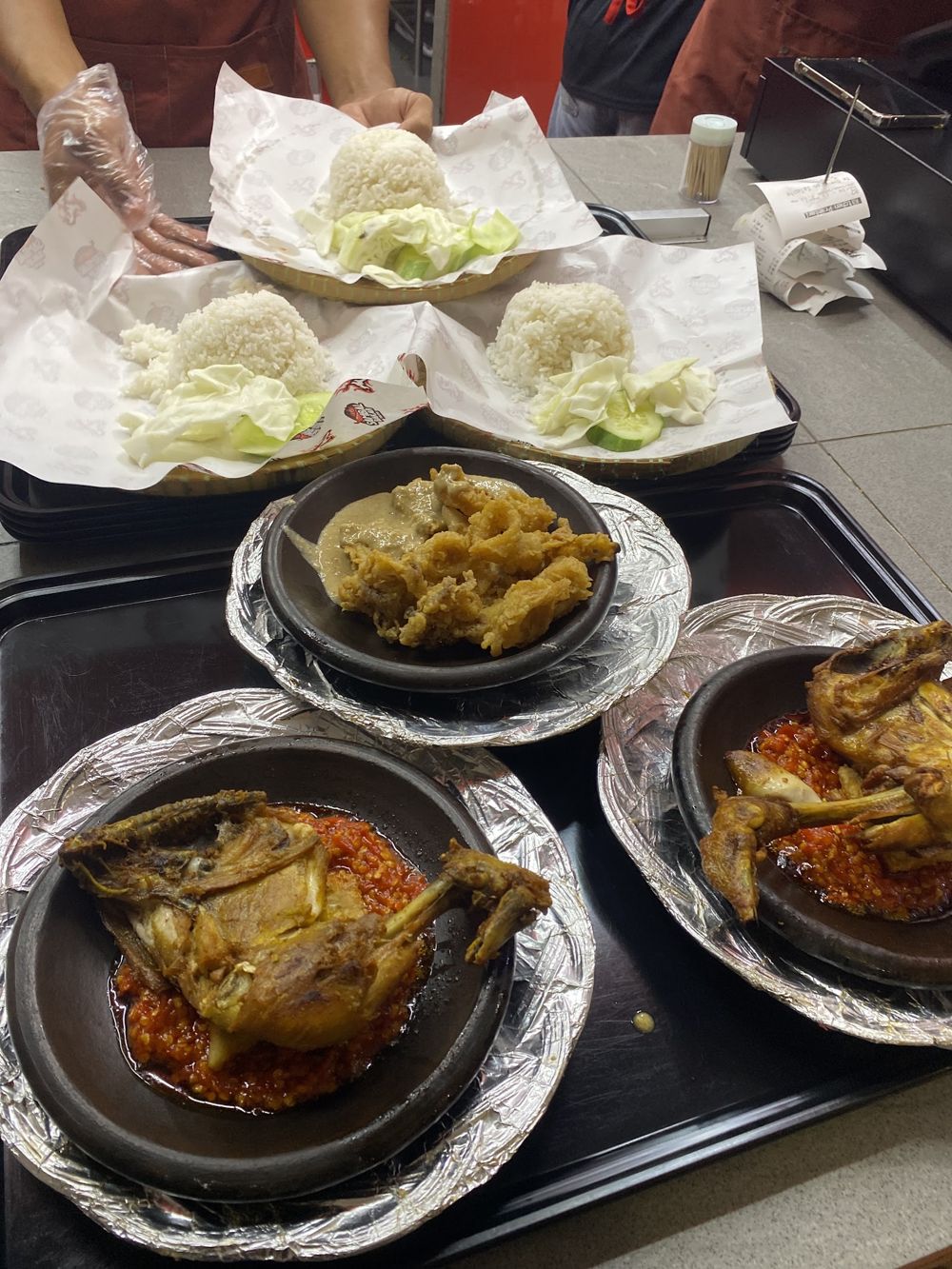 Ayam in red sambal in clay bowls