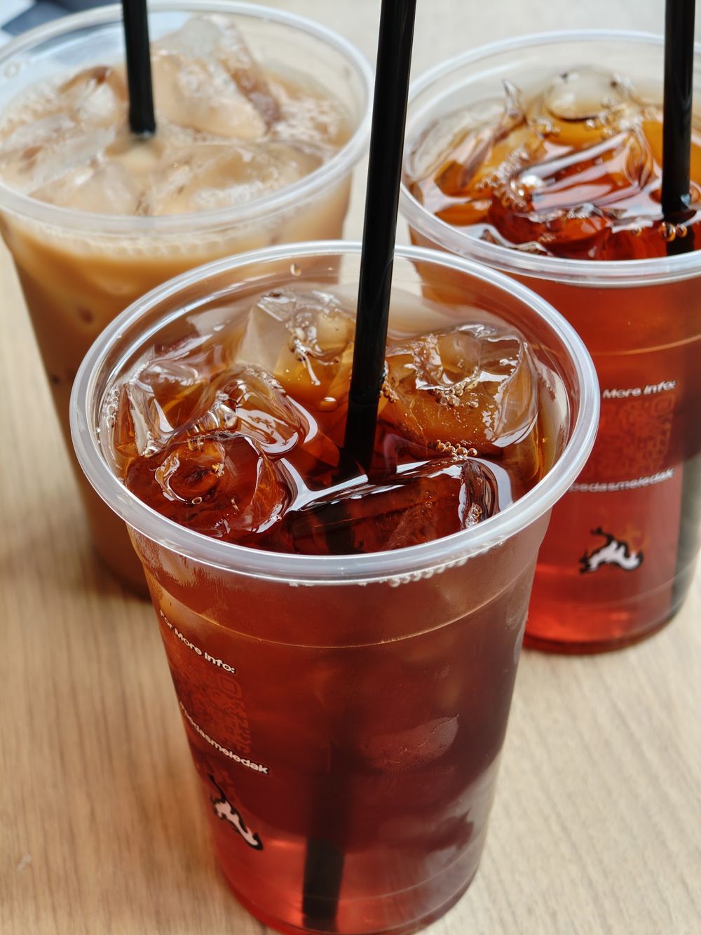 Iced drinks in branded cups